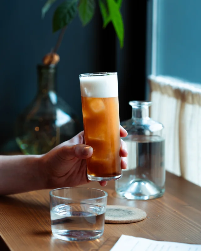 M&M—a highball twist on a modern classic shooter. @thelostexplorer Mezcal and Amaro Montenegro, spiced with Ancho Reyes liqueur and burnt coffee syrup, topped with foamy bubbles. Shaken and served into an ice-cold glass. Perfect to kick off or wind down the night at No. 23.