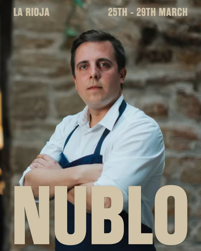 Michelin-starred Nublo is a homecoming for Miguel Caño who earned his stripes at the revered Mugaritz**, rising to head chef at just 32. Now, he’s back in Haro, cooking on his own terms.

Housed in a 16th-century palacio, Nublo is a love letter to La Rioja’s rich culinary landscape, set in the heart of Spain’s most celebrated winemaking region. Disruptive yet deeply rooted in tradition, the restaurant strips back modernity to its bare essentials, cooking dishes like ‘Sea bream with leche de tigre’ (served skewered on a flowering branch of elder) and ‘Bonito with sarmiento and green pepper’ exclusively over firewood. Each dish is a response to the land, shaped daily by the finest local, seasonal ingredients. As Elle puts it, “A celebration of nature in its most primary state.”

The dining room, a glass-roofed courtyard enclosed by ancient stone, is presided over by an ethereally veiled figure—the goddess Nublo—the restaurant’s namesake and guiding spirit. Here, Miguel leads diners on a culinary journey through La Rioja, reimagining its ingredients with precision and creativity.

Take all these elements—heritage, fire, terroir—and, as the Michelin Guide puts it, “The end result is perfect.“

Photos by Mario Urquiaga