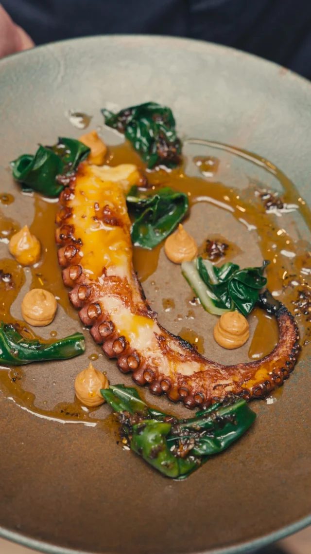 This week we&rsquo;re joined by Manu N&uacute;&ntilde;ez and Marta Morales of Batea, Barcelona&rsquo;s triumphant temple to seafood.

Here, the food and drink move together. Manu&rsquo;s layered, produce-led seafood cookery is matched step for step by Marta&rsquo;s sharp, elegant cocktails, making this one feel less like a residency and more like being dropped directly into a buzzing Barcelona dining room.

On the menu, dishes like &lsquo;Sea bass crudo, corn, spicy romesco, hazelnut, escarole,&rsquo; where clean, cured fish meets sweet corn in liquid form, with fermented chilli bringing unexpected heat to the romesco. Or &lsquo;Charcoal grilled octopus, seaweed chimichurri, chorizo &ldquo;suquet&rdquo;. That&rsquo;s octopus seared hard, grilled over coals, complemented by an equally inventive turf to its surf.

Alongside them, Marta&rsquo;s cocktails: a Strawberry Negroni infused for 24 hours until bitter and fruit sit side by side, a perfectly savoury Onion Martini built from roasted onions steeped in gin, and a roasted red pepper paloma.

It&rsquo;s thoughtful food, smart drinks and the kind of warm hospitality that keeps Barcelona&rsquo;s in-the-know coming back to Batea time and time again.

Four nights left, don&rsquo;t miss it.